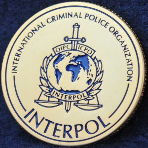 INTERPOL 100 years of International Police Cooperation Gold 2