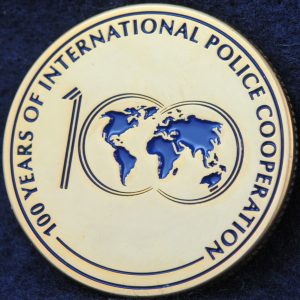 INTERPOL 100 years of International Police Cooperation Gold
